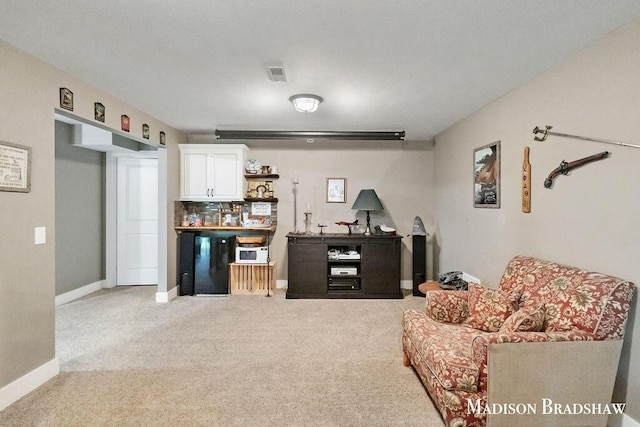 1728 N Brandon Ridge Dr NW, Walker, MI 49544 - living area with light carpet and baseboards
