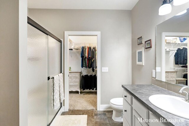 1728 N Brandon Ridge Dr NW, Walker, MI 49544 - full bath with a spacious closet, vanity, and a stall shower