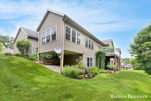 1728 N Brandon Ridge Dr NW, Walker, MI 49544 - rear view of property featuring a lawn and a carport