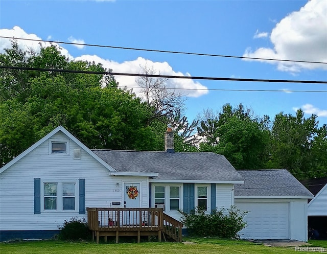 1460 S Dye Rd, Flint, MI 48532 - view of front facade featuring a wooden deck, a chimney, a shingled roof, and an attached garage