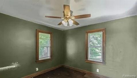1460 S Dye Rd, Flint, MI 48532 - empty room with a ceiling fan and baseboards