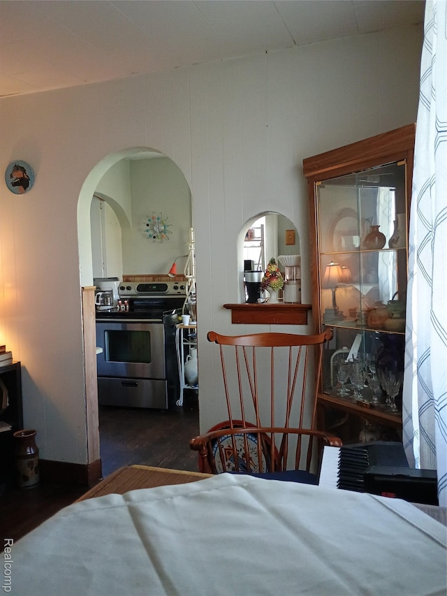 1460 S Dye Rd, Flint, MI 48532 - bedroom with arched walkways and dark wood-style floors