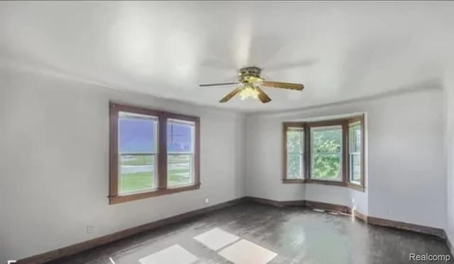 1460 S Dye Rd, Flint, MI 48532 - spare room with healthy amount of natural light and a ceiling fan