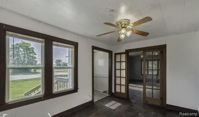 1460 S Dye Rd, Flint, MI 48532 - spare room featuring french doors and a ceiling fan