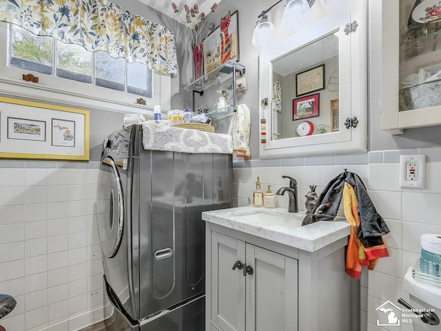 2252 W Temperance Rd, Temperance, MI 48182 - washroom featuring tile walls and washer / clothes dryer