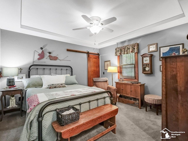 2252 W Temperance Rd, Temperance, MI 48182 - bedroom with a raised ceiling, carpet flooring, a barn door, and ceiling fan