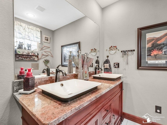 2252 W Temperance Rd, Temperance, MI 48182 - bathroom with double vanity and a textured wall