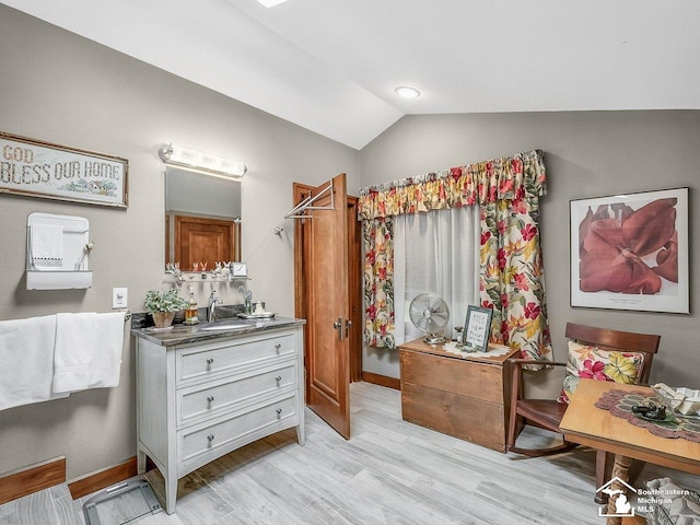 2252 W Temperance Rd, Temperance, MI 48182 - bathroom with vanity, wood finished floors, and lofted ceiling