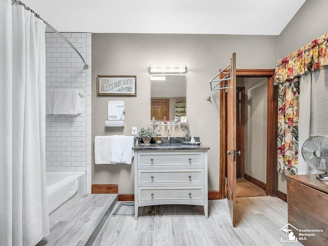 2252 W Temperance Rd, Temperance, MI 48182 - full bath featuring vanity, shower / bath combo with shower curtain, and wood finished floors