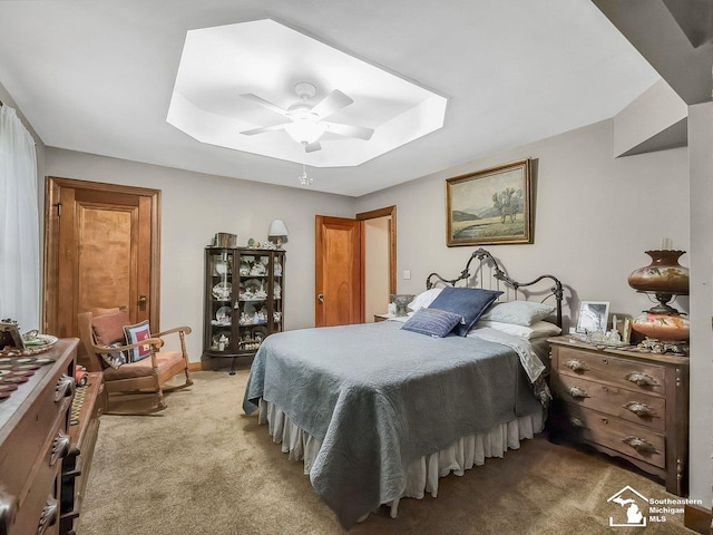 2252 W Temperance Rd, Temperance, MI 48182 - bedroom featuring light colored carpet, ceiling fan, and a raised ceiling