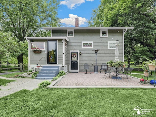 2252 W Temperance Rd, Temperance, MI 48182 - back of property featuring a chimney, a patio, and entry steps