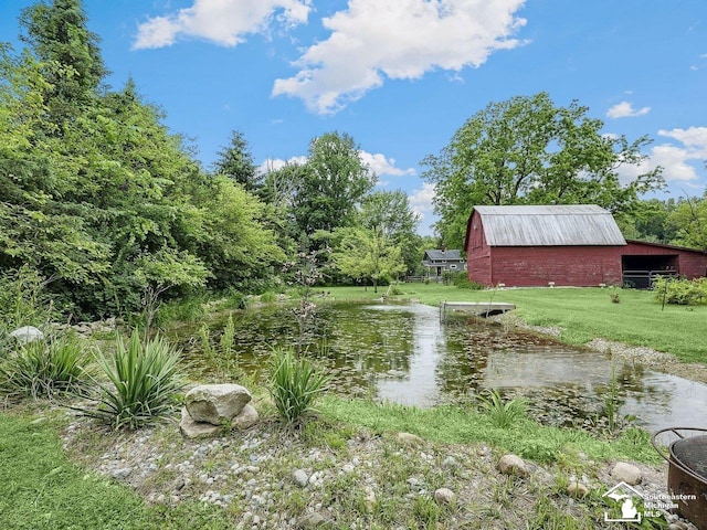 2252 W Temperance Rd, Temperance, MI 48182 - view of green lawn featuring a water view, an outdoor structure, and a barn