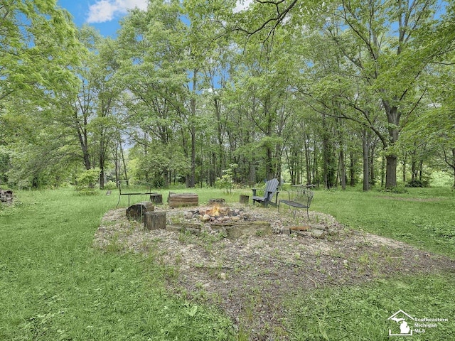 2252 W Temperance Rd, Temperance, MI 48182 - view of yard featuring an outdoor fire pit