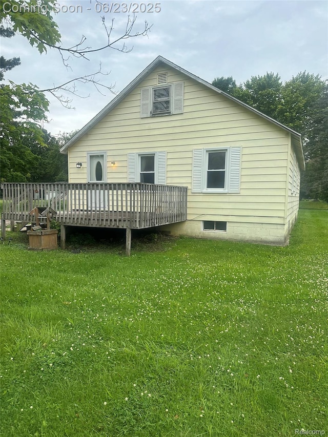 1106 S Vassar Rd, Burton, MI 48509 - rear view of property featuring a deck and a yard