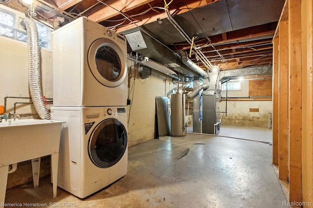 42424 Bradner Ct, Plymouth, MI 48170 - laundry room with stacked washer and clothes dryer, heating unit, and water heater