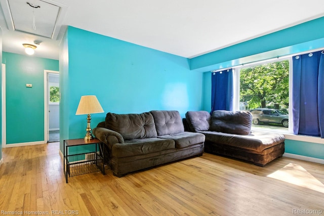 42424 Bradner Ct, Plymouth, MI 48170 - living room with attic access, hardwood / wood-style flooring, and plenty of natural light
