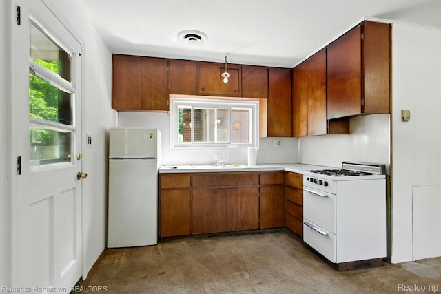 42424 Bradner Ct, Plymouth, MI 48170 - kitchen featuring white appliances, plenty of natural light, and light countertops