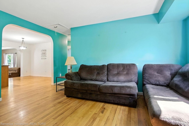 42424 Bradner Ct, Plymouth, MI 48170 - living room featuring wood finished floors and attic access