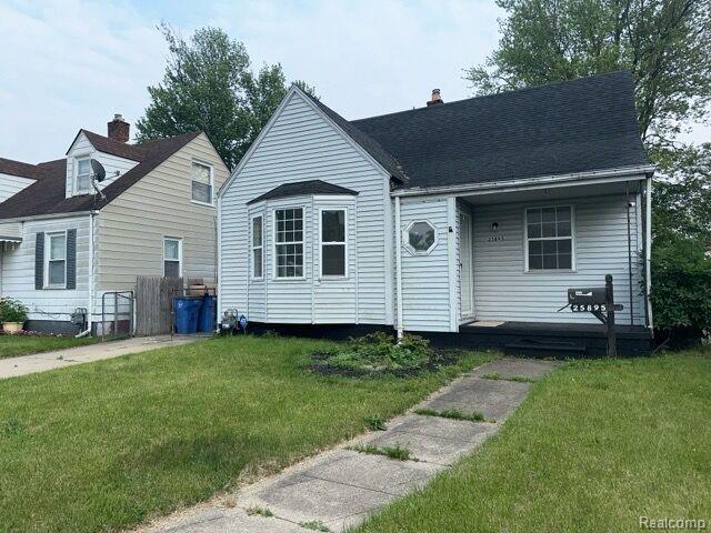 25895 Annapolis St, Dearborn Heights, MI 48125 - view of front facade featuring a front lawn, a chimney, and a porch