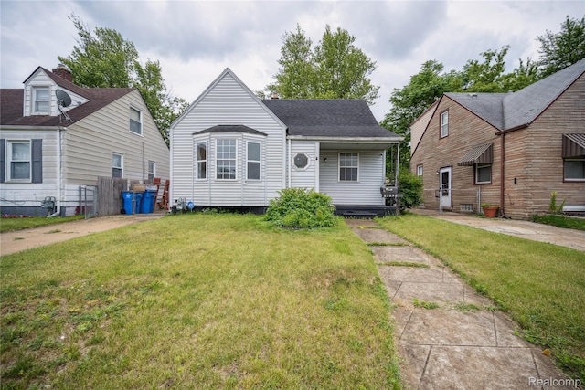 25895 Annapolis St, Dearborn Heights, MI 48125 - view of front of home with a front lawn and a shingled roof