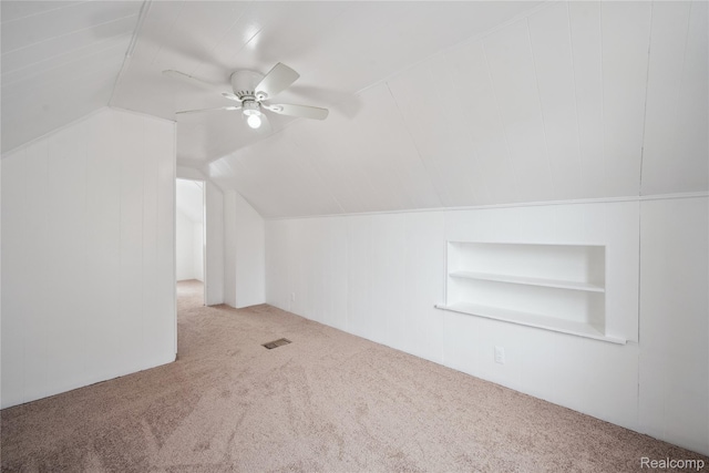 25895 Annapolis St, Dearborn Heights, MI 48125 - additional living space featuring carpet floors, built in shelves, a ceiling fan, and lofted ceiling