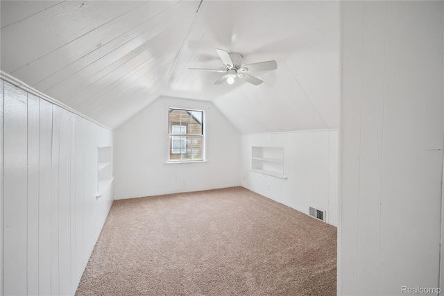 25895 Annapolis St, Dearborn Heights, MI 48125 - additional living space featuring built in shelves, carpet, lofted ceiling, and a ceiling fan