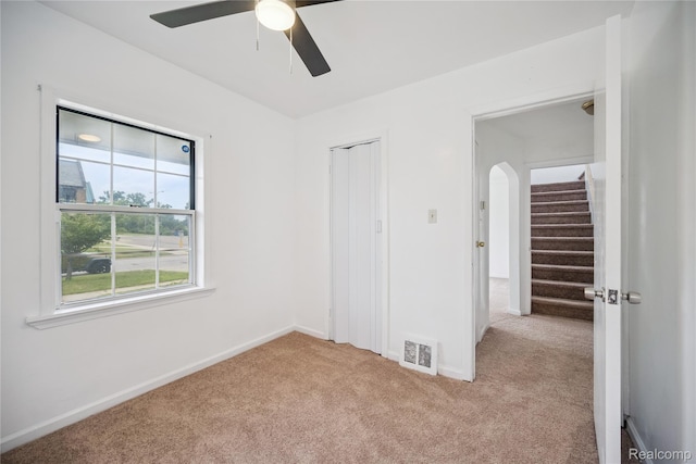 25895 Annapolis St, Dearborn Heights, MI 48125 - unfurnished bedroom featuring light carpet, a closet, and ceiling fan