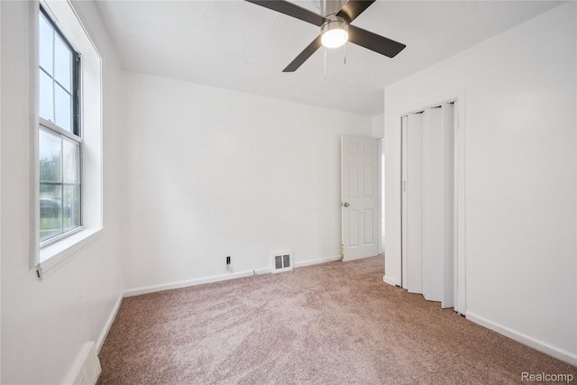 25895 Annapolis St, Dearborn Heights, MI 48125 - unfurnished bedroom with carpet floors, multiple windows, ceiling fan, and a closet