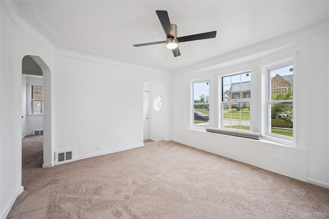 25895 Annapolis St, Dearborn Heights, MI 48125 - empty room with arched walkways, carpet floors, and ceiling fan