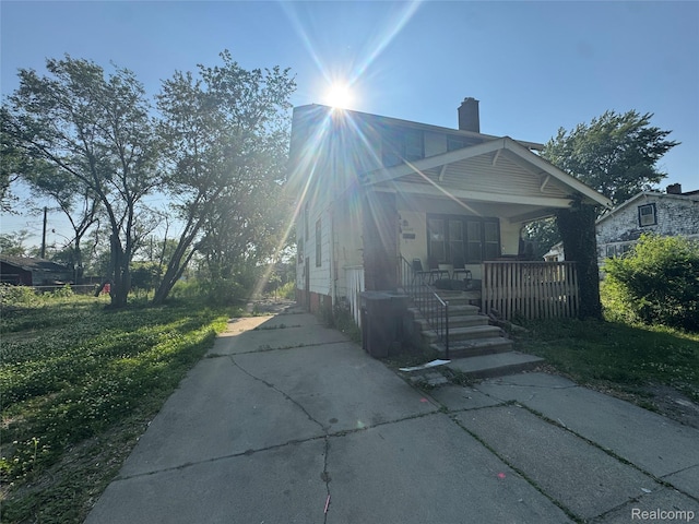 11343 Belleterre St, Detroit, MI 48204 - view of front of home featuring a porch and a chimney