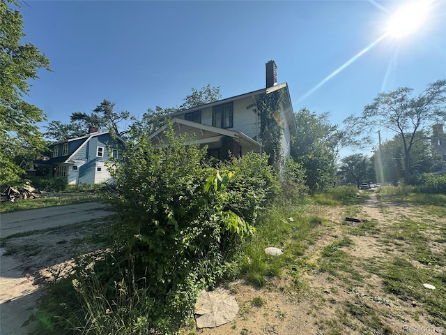 11343 Belleterre St, Detroit, MI 48204 - view of side of property with a chimney
