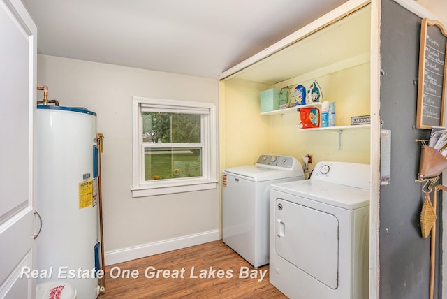 4185 Shattuck Rd, Saginaw, MI 48603 - laundry room featuring water heater, separate washer and dryer, and light wood-style floors