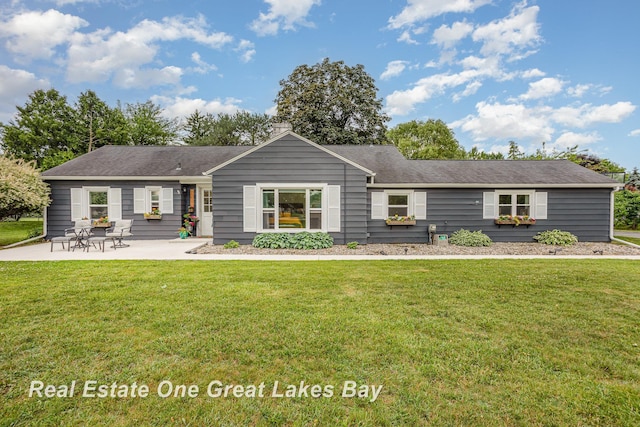 4185 Shattuck Rd, Saginaw, MI 48603 - view of front of house featuring a front lawn and a patio