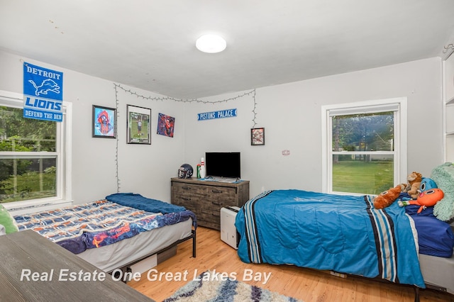 4185 Shattuck Rd, Saginaw, MI 48603 - bedroom featuring wood finished floors
