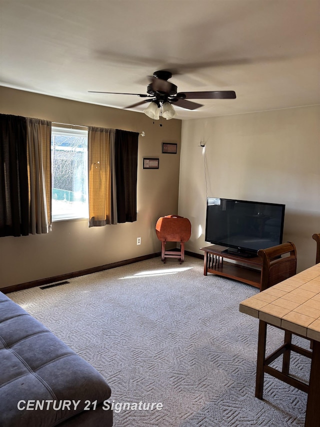 11424 Hazel Ave, Grand Blanc, MI 48439 - living room featuring a ceiling fan and carpet flooring