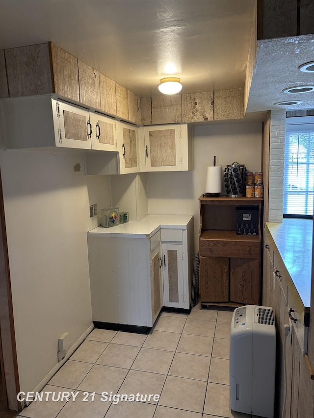 11424 Hazel Ave, Grand Blanc, MI 48439 - kitchen featuring light tile patterned flooring and light countertops