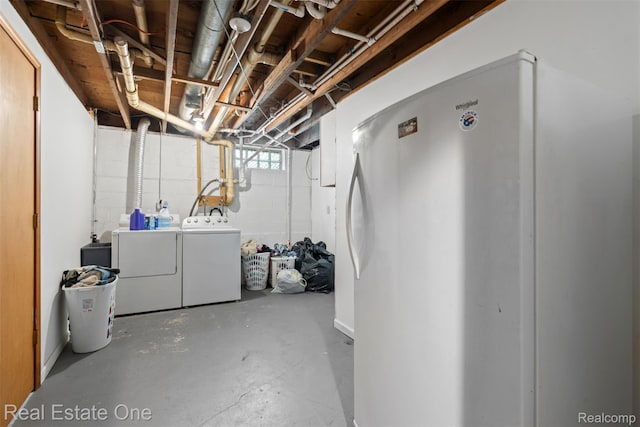 6617 Kilburn Rd, Grant, MI 48032 - basement featuring washing machine and clothes dryer and freestanding refrigerator