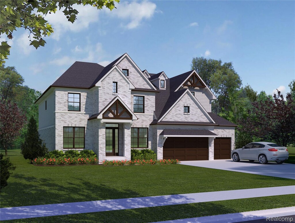 556 Eckford Dr, Troy, MI 48085 - view of front of home with a front yard, driveway, brick siding, and a garage