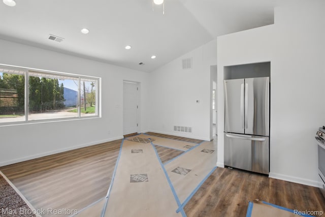 165 W Colgate Ave, Pontiac, MI 48340 - kitchen featuring freestanding refrigerator, vaulted ceiling, wood finished floors, recessed lighting, and range