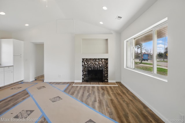 165 W Colgate Ave, Pontiac, MI 48340 - unfurnished living room with lofted ceiling, recessed lighting, wood finished floors, and a fireplace