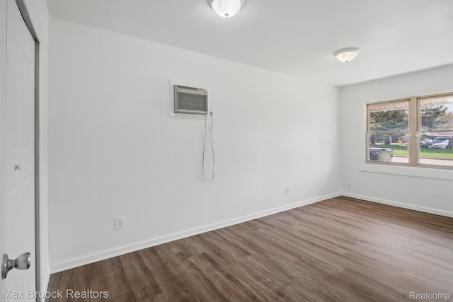 165 W Colgate Ave, Pontiac, MI 48340 - unfurnished room with dark wood-style flooring and an AC wall unit
