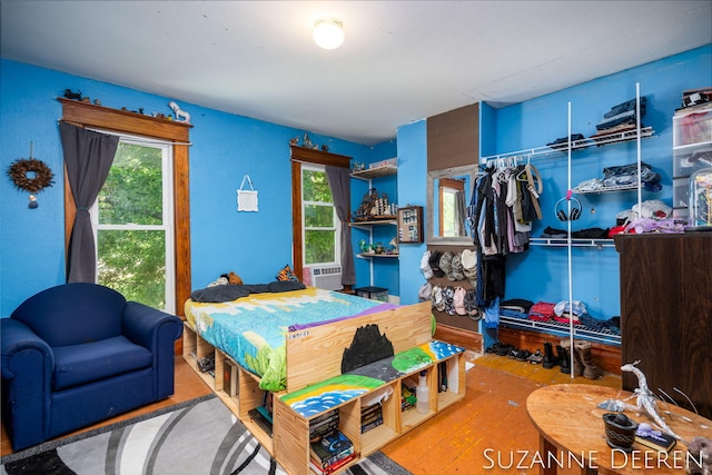 409 W Bridge St, Lyons, MI 48851 - bedroom featuring multiple windows and wood finished floors