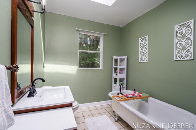 409 W Bridge St, Lyons, MI 48851 - bathroom with a freestanding tub, vanity, and tile patterned flooring