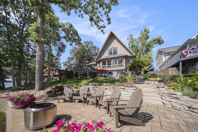117 High View Ct, Brooklyn, MI 49230 - view of patio featuring a fire pit