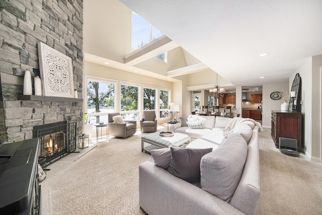 117 High View Ct, Brooklyn, MI 49230 - living area with a fireplace, a high ceiling, light carpet, a chandelier, and recessed lighting