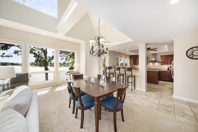 117 High View Ct, Brooklyn, MI 49230 - dining space featuring recessed lighting, a water view, a chandelier, a towering ceiling, and light colored carpet