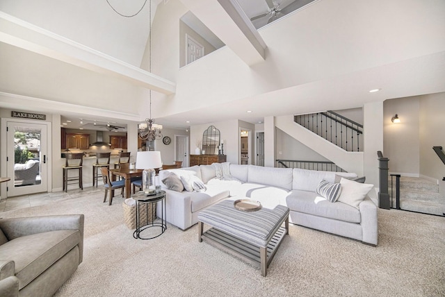 117 High View Ct, Brooklyn, MI 49230 - living area with light carpet, a towering ceiling, stairs, recessed lighting, and a chandelier