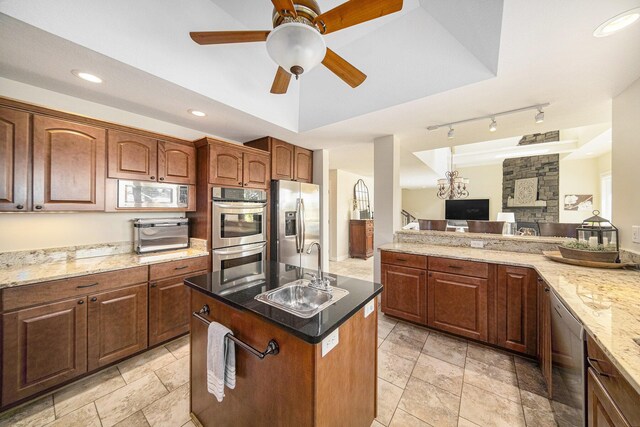 117 High View Ct, Brooklyn, MI 49230 - kitchen with appliances with stainless steel finishes, ceiling fan, a kitchen island with sink, light stone counters, and recessed lighting