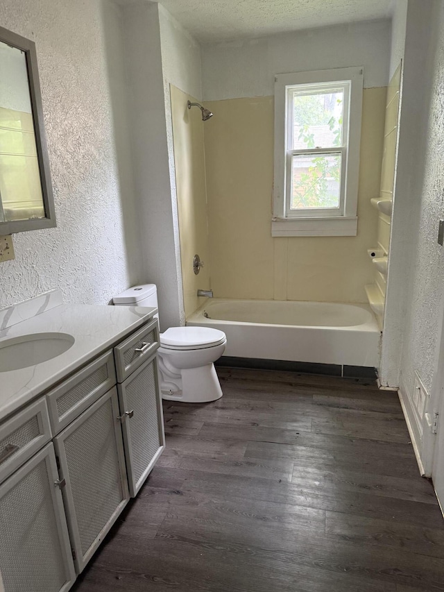 774 Amity Ave, Muskegon, MI 49442 - full bath featuring a textured wall, vanity, wood finished floors, and  shower combination