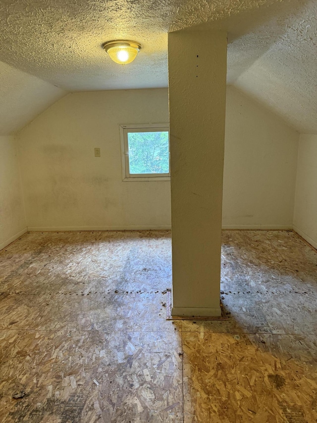 774 Amity Ave, Muskegon, MI 49442 - bonus room featuring lofted ceiling and a textured ceiling
